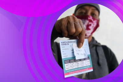 someone holding a covid vaccine card