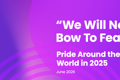 Person holding inclusive rainbow flag