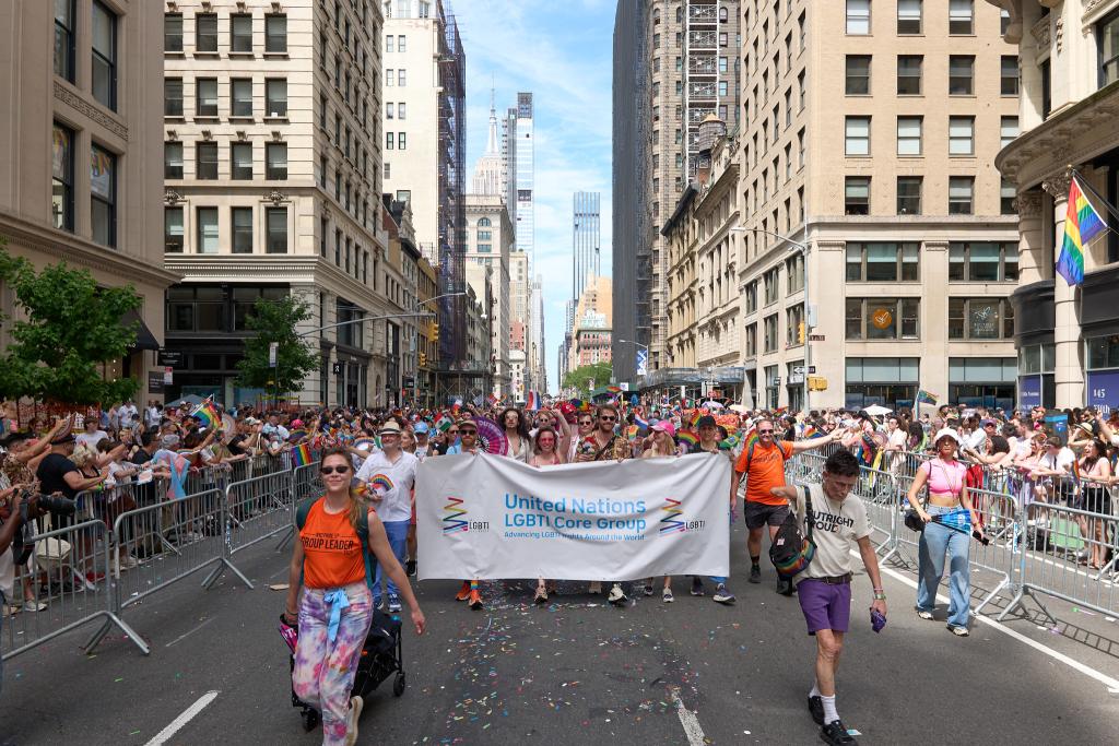 Large group photo of people marching in the street during NY Pride